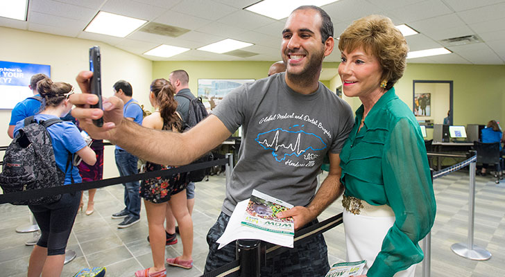 USF President Judy Genshaft greets students during the first week of classes.