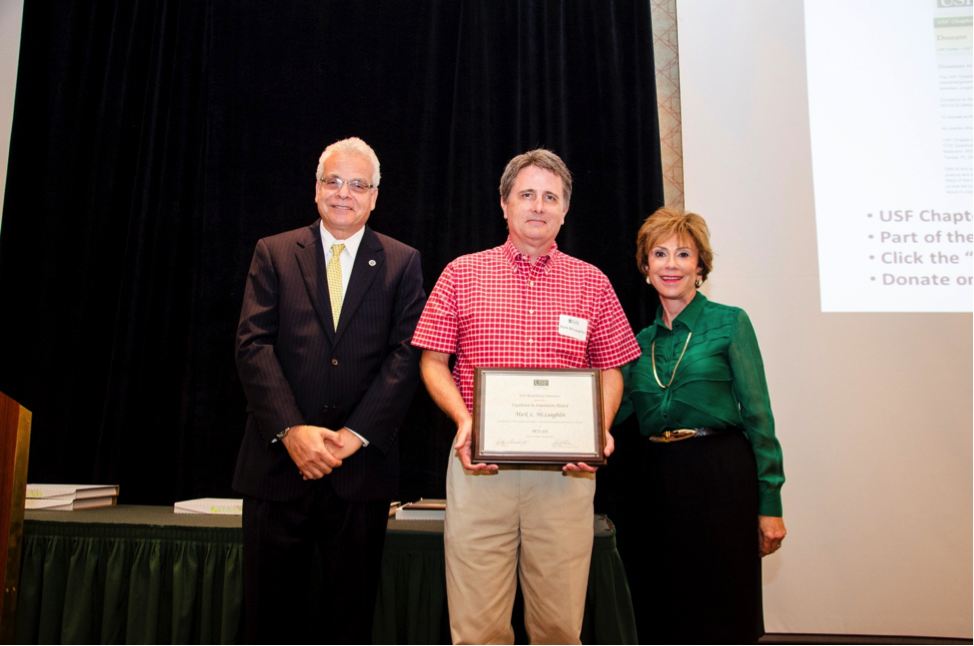Mark McLaughlin receives his award (Photo: Aimee Blodgett).